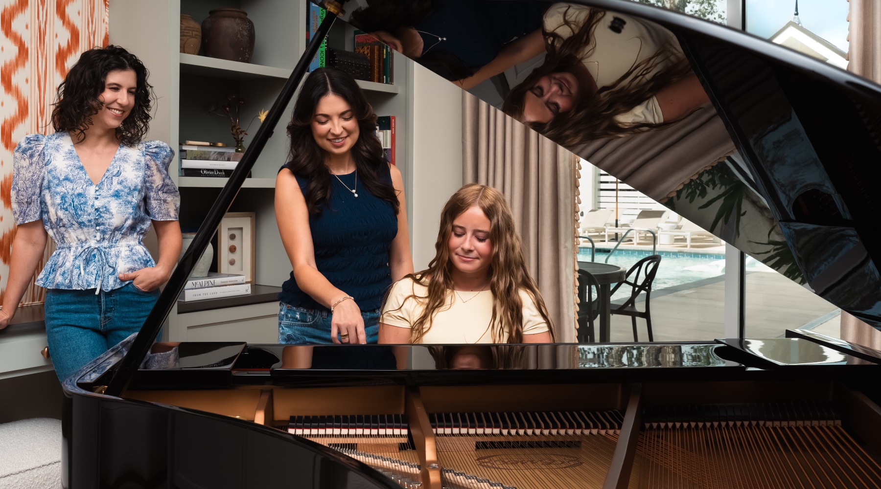 Group of people enjoying the grand piano